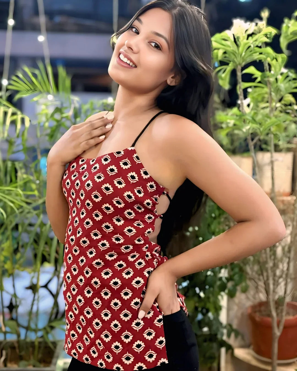 Red floral print sleeveless top with black straps, stylish women's fusion wear